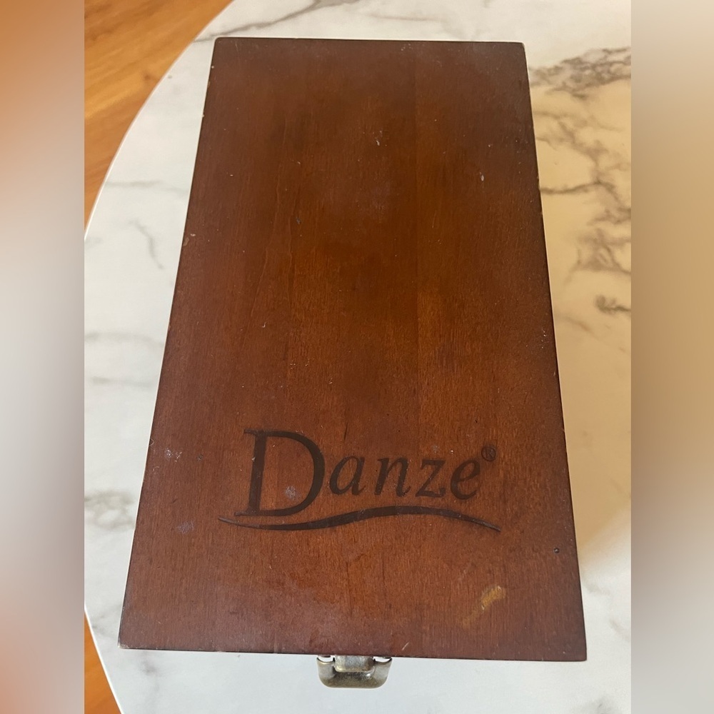 Wooden box for displaying coins with the name marked Danze logo